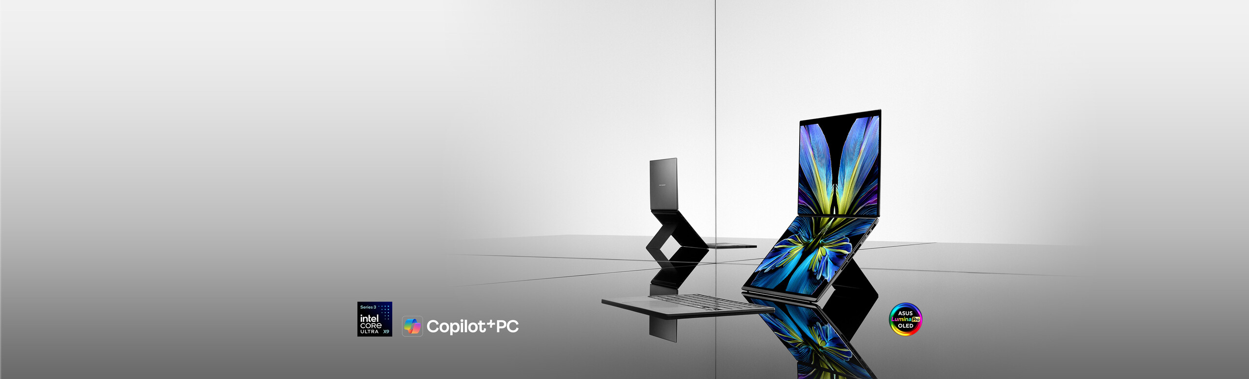 Two ASUS Zenbook DUO are displayed in a minimalist, reflective setting.